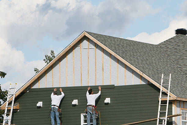 Professional Siding technician working in Dyke, VA